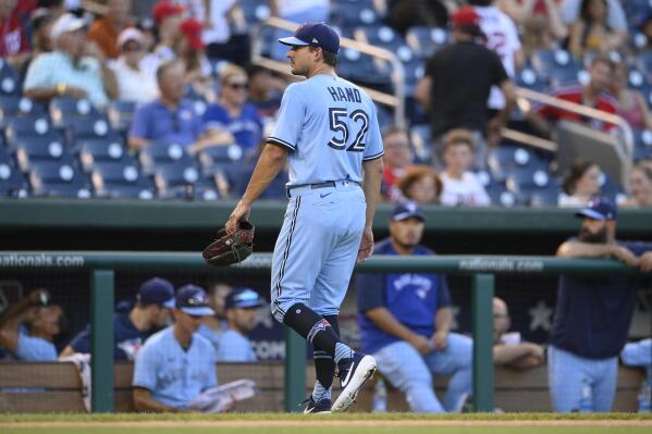 Mets claim 3 time All Star reliever Brad Hand from Blue Jays AP News